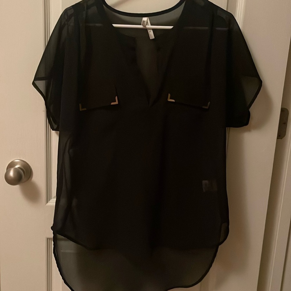 Black blouse with a tad  of gold